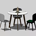 Modern Round White Dining Table Set With Three Different Colored Chairs And Vase 3d model