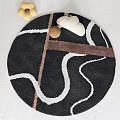 Stylish Round Rug With Black Base White Curved Lines And Brown Accent Design Pattern