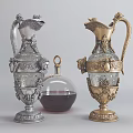 Ornate Silver And Gold Vases With Floral Patterns And Glass Decanter