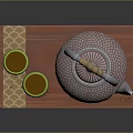 Traditional Patterned Teapot With Wooden Handle And Green Teacups On Red Wooden Tray