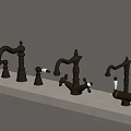Three Classic Brass Faucets Arranged On Light Countertop With Elegant Handles