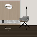Modern Gray Quilted Single Chair In Living Room With Fireplace And Floor Lamp