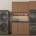 Stacked Front Loading Washing Machines In Laundry Room With Wooden Cabinets Sink And Countertop