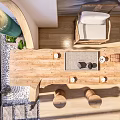 Natural Wooden Tea Table And Chairs With Tea Set And Stone Decorations In Bright Room