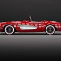 Red Classic Convertible Sports Car With Chrome Accents White Wall Tires And Retro Design