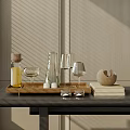 Stylish Glass Cups Arranged On Wooden Tray With Books And Spherical Decor