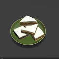 Fresh Tasty Square Shaped Cakes with White Frosting on Green Plate