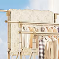 Sturdy Clothes Drying Rack With Hanging Clothes In Living Room Interior