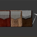 Three Different Colored Wooden Kalimba Musical Instruments With Decorative Patterns And Small Hammer