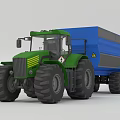 Green Farm Tractor with Blue Trailer Loaded with Hay for Agricultural Transport