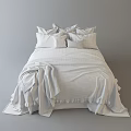 Double Bed with White Sheets and Beige Blanket and Decorative Patterned Pillows for Cozy Bedroom