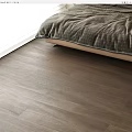 Modern Bedroom Interior Featuring Natural Wood Flooring With Warm Texture And Cozy Bedding
