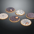 Festive Halloween Cookies With Spider Web Designs And Small Spider Decorations