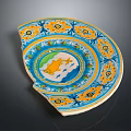 Chipped Ornate Ceramic Plate With Yellow Blue Green Patterns And Central Fish Design