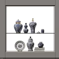 Decorative Blue and White Ceramic Vessels of Various Sizes on Display Shelf