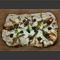 Delicious Homemade Pizza Topped With Fresh Vegetables Olives And Melted Cheese On Wooden Serving Board