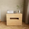 Cozy Bedroom Interior With Wooden Nightstand Radio Clock And Plant On Herringbone Floor