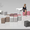 Public Chairs In Various Colors And Different Shapes With Small Tables And Green Plants