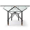 Sleek Glass Top Table With Black Metal Frame And Rolling Wheels Design