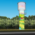 Painted Water Tower With Colorful Mural Surrounded By Green Trees And Reflection On Water Surface