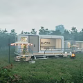Modern Container Style Guesthouse Building Set In Misty Grassland With Trees Terrace And Outdoor Seating