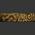 Golden Decorative Ring With Intricate Carved Patterns And Shiny Surface