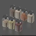 Set of Glass Spice Jars With Metal Lids Containing Various Colored Seasonings