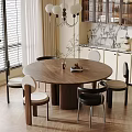 Modern Restaurant Dining Area With Round Wooden Table Chairs Pendant Light And Potted Plant
