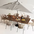 Outdoor Perforated Wooden Table with Large White Umbrella Wicker Chairs and Tableware