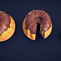 Three Round Bundt Cakes With Chocolate Glaze Sliced To Show Layered Inside On Dark Background
