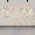 Elegant Modern Hinged Door with Glass Panels and Spiral Pendant Lights in White Room