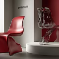 Red and Transparent Modern Dining Chairs Displayed on White Platform with Red Walls