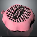 Pink Round Whoopee Cushion With Black And White Checkerboard Pattern