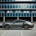 Silver Luxury Sports Car With Sleek Design And Alloy Wheels Parked In Modern Parking Lot
