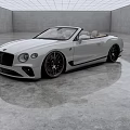 White Luxury Convertible Car With Beige Seats Large Alloy Wheels In Minimalist Indoor Space