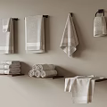 Neutral Colored Bathroom Towels Hanging On Wall Shelves With Folded Stacks