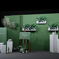 Elegant Photo Check-in Spot With Green Wall Flower Arrangements Easel Logo And White Pillars