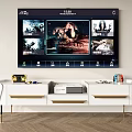Wall Mounted Smart TV Displaying Multiple Movie Posters In Modern Living Room With White TV Stand