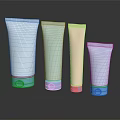 Pastel Colored Cosmetic Tube Containers With Blue Base Caps On Black Reflective Background