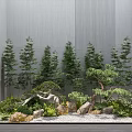Small Garden Landscape With Various Trees Stones Shrubs Gravel And Wooden Planks Against Gray Walls