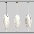Modern White Fringed Pendant Lights With Black Gold White Cords Against Gray Wall