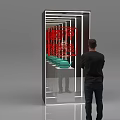 Man Viewing Commercial Display Equipment with Mirrors Lighting and Neatly Arranged Green Bowl Shaped Objects