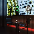 Bar Interior Featuring Wine Bottle Display Green Cartoon Doll Round Table Black Chairs Red Lighting