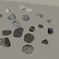 Various Sizes And Colors Of Stones And Wood Scattered On Light Background