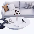 Gray Sofa and White Oval Coffee Table Set with Decorative Pillows Dried Flowers and Open Book