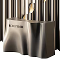 Modern Store Reception Desk Featuring Metallic Finish Sign Against Vertical Metallic Strips And Golden Lights