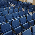 Modern Conference Room Interior Design With Blue Chairs Podium And Large Screen
