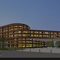 Modern Commercial Complex With Curved Glass Facade And Illuminated Exterior Surrounded By Plaza And Trees
