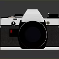 Vintage Electronic Camera With Silver And Black Design And Classic Lens