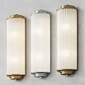 Modern Wall Lamps With Gold And Silver Frames And White Vertical Ribbed Shades On Wall